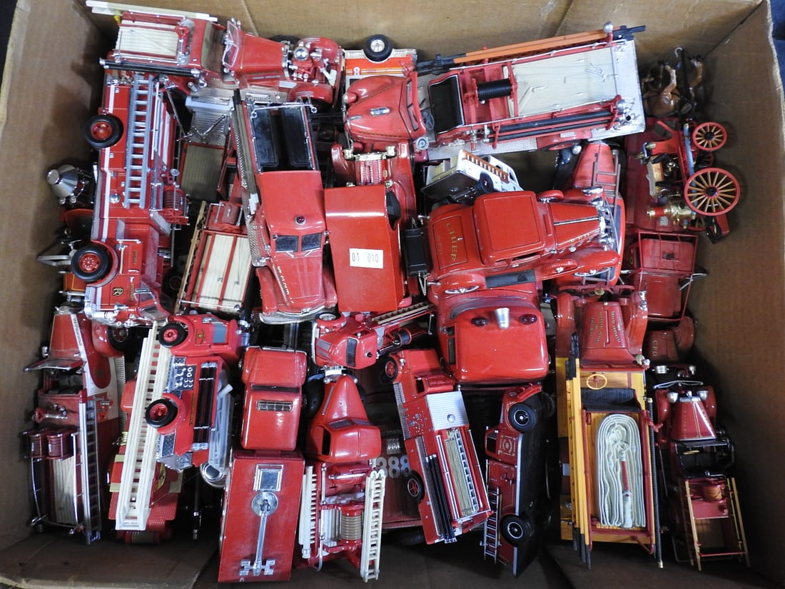Large Collection of Model Fire Engines and Emergency Trucks: Large mixed-scale collection of fire engines, ladder trucks and emergency vehicles, primarily loose and unboxed. Includes approximately 25 or more models shown.