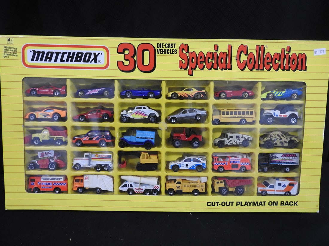 1993 Matchbox 30 Die-Cast Vehicles Special Collection: Boxed 1993 Matchbox Special Collection containing 30 assorted die-cast vehicles, with a printed cut-out playmat on the reverse.