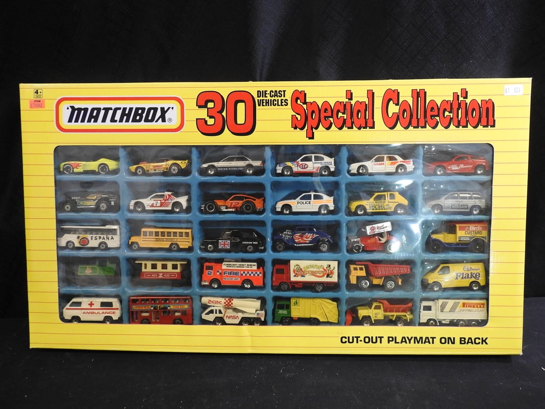 1992 Matchbox 30 Die-Cast Vehicles Special Collection: Boxed 1992 Matchbox Special Collection containing 30 assorted die-cast vehicles with a printed cut-out playmat.
