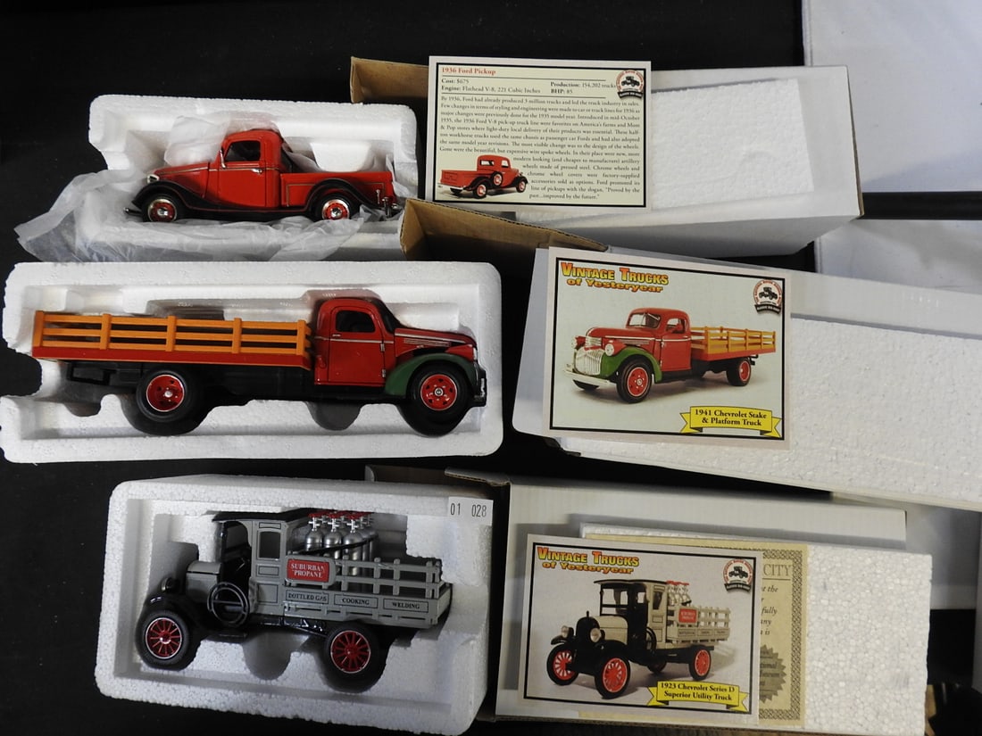 National Motor Museum Mint Vintage Truck Models, Lot of 3: Three Vintage Trucks of Yesteryear models with certificates and foam packaging: 1936 Ford Pickup, 1941 Chevrolet Stake and Platform Truck, and 1923 Chevrolet Series D Superior Utility Truck.
