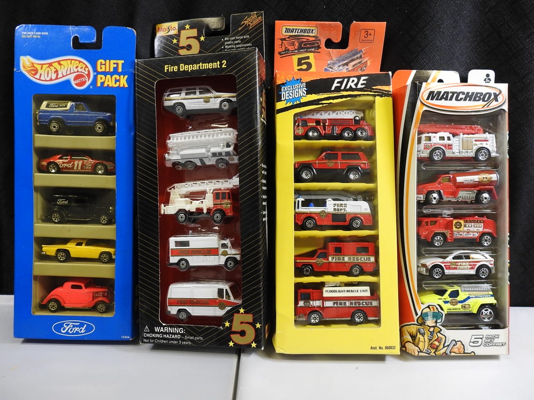 Hot Wheels and Matchbox Ford and Fire Vehicle Gift Packs, Lot of 4: Four packaged five-vehicle sets, including a Hot Wheels Ford Gift Pack, Fire Department 2 and two Matchbox fire and rescue assortments.
