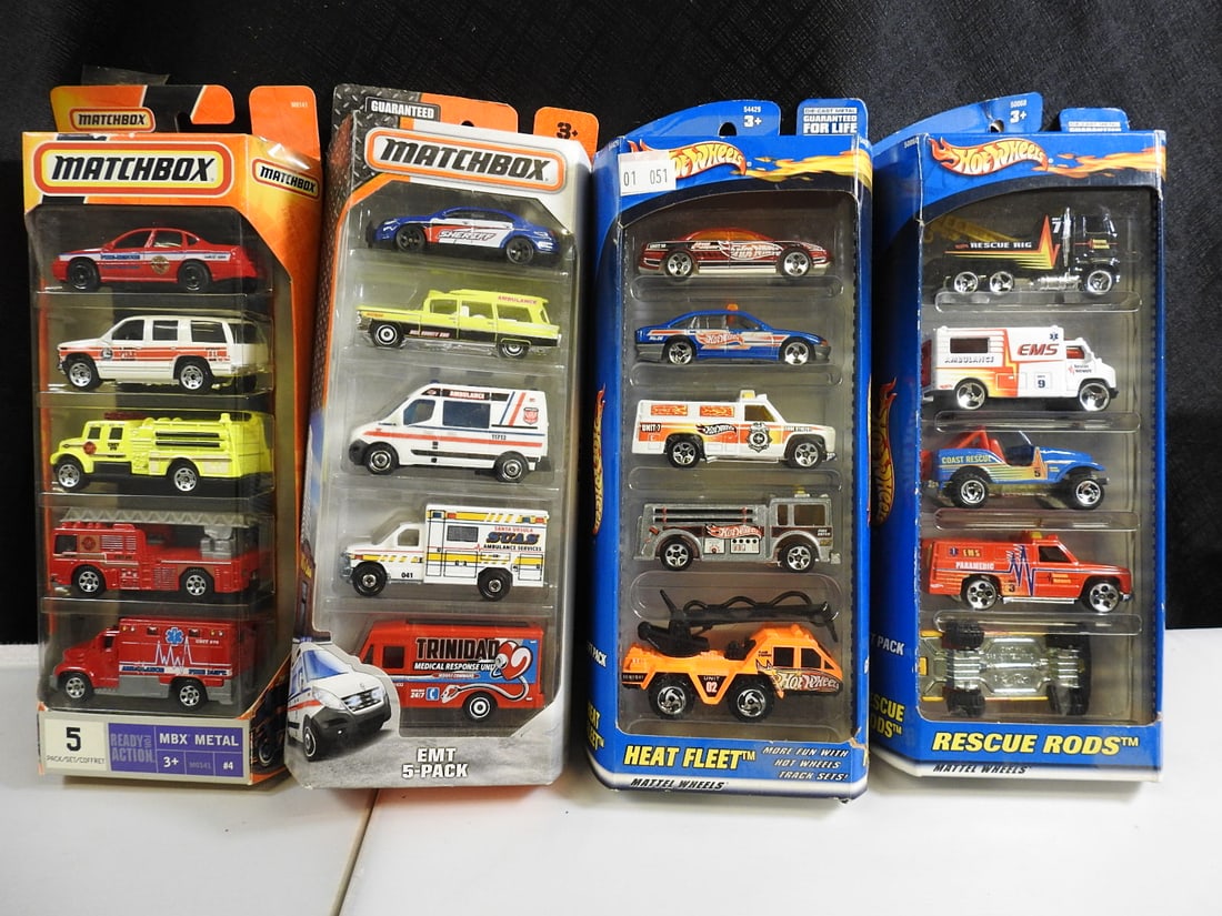 Matchbox and Hot Wheels Emergency Vehicle Sets, Lot of 4: Four packaged emergency-vehicle assortments, including Matchbox fire and ambulance sets and Hot Wheels Heat Fleet and Rescue Rods five-packs.