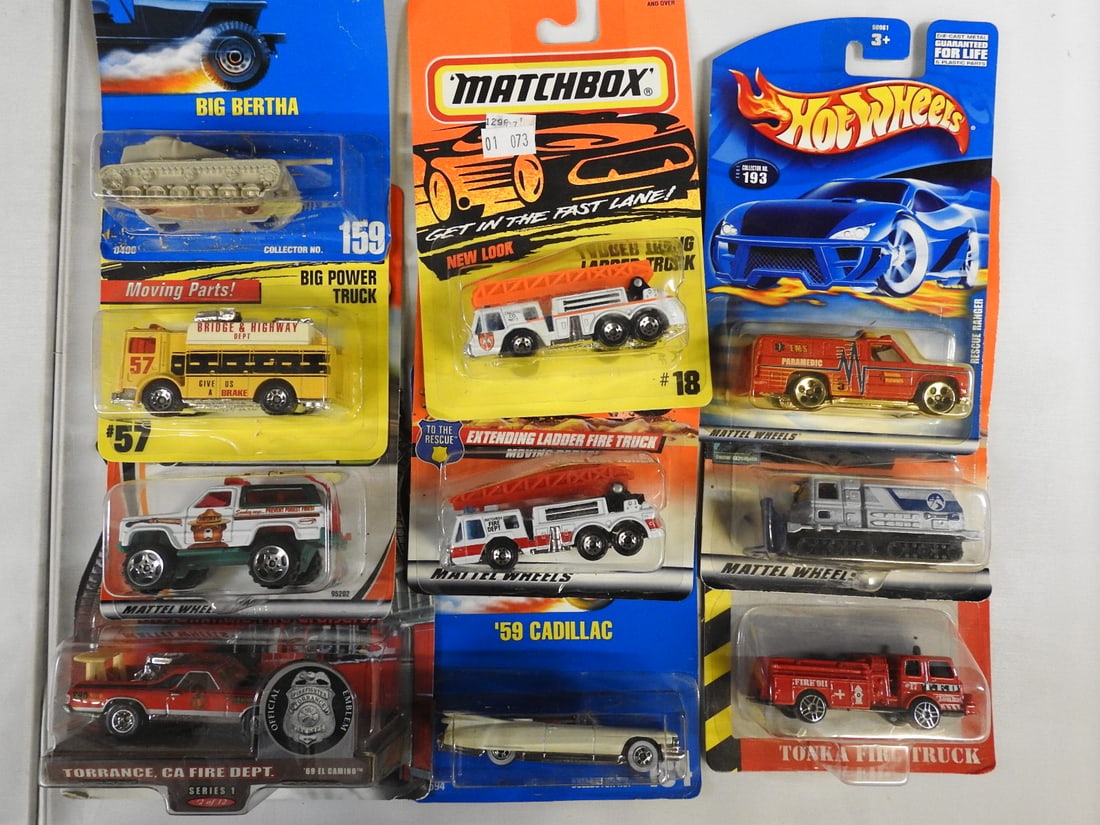 Hot Wheels, Matchbox and Tonka Carded Vehicles, Lot of 9: Nine carded die-cast vehicles featuring fire, rescue and specialty subjects. Includes Matchbox ladder trucks and Chevrolet Blazer, Hot Wheels Big Bertha, 1959 Cadillac and Fire Department Rods, plus a