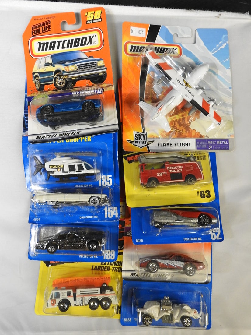 Hot Wheels and Matchbox Carded Vehicles, Lot of 10: Ten carded Hot Wheels and Matchbox vehicles, including Flame Flight aircraft, Snorkel and extending ladder trucks, Gleaner Patrol, 1959 Cadillac, Ratmobile, Alien and Propper Chopper.
