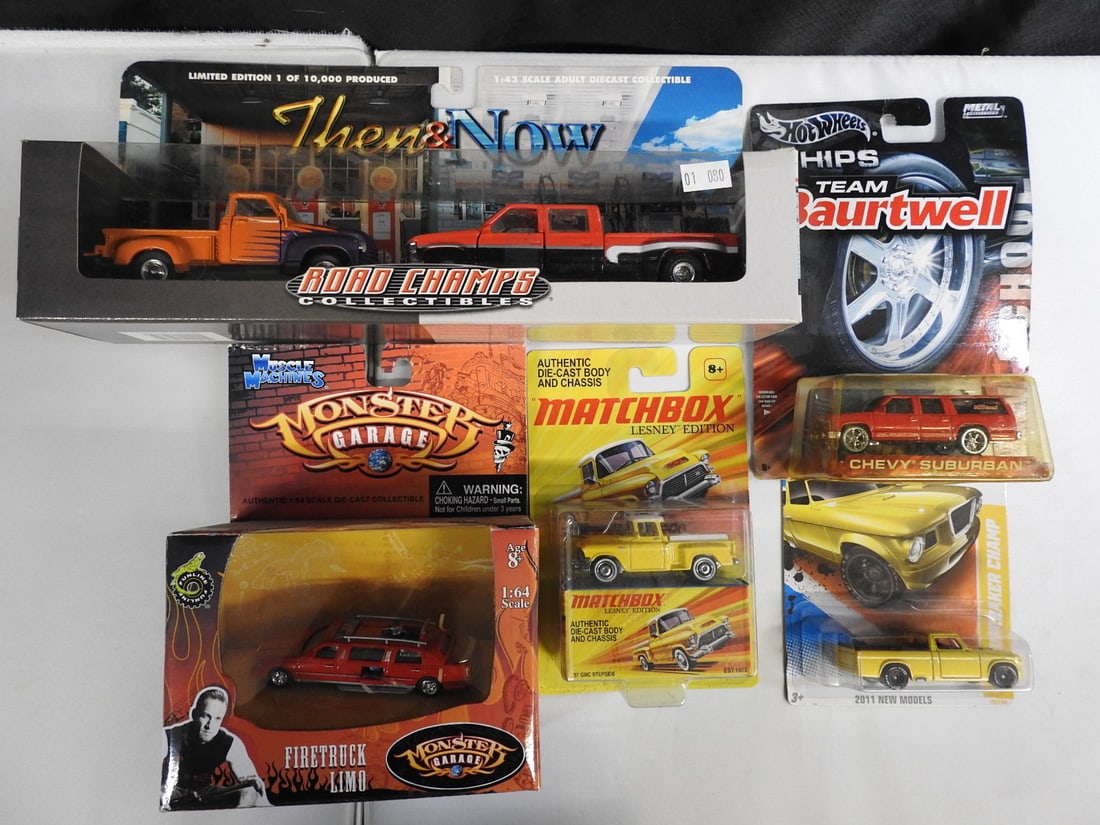 Road Champs, Monster Garage, Matchbox and Hot Wheels Vehicles: Mixed packaged vehicle group featuring a Road Champs Then & Now Chevrolet set, Monster Garage Firetruck Limo, Matchbox Lesney Edition vehicle and Hot Wheels Team Baurtwell, 1971 Plymouth GTX and