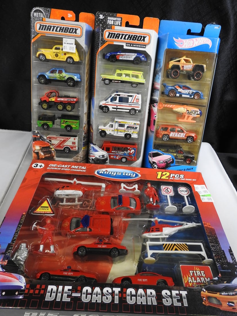 Matchbox, Hot Wheels and King's Toy Emergency Vehicle Sets: Mixed packaged emergency-vehicle group comprising Matchbox fire-rescue and EMT five-packs, a Hot Wheels Rescue Racers five-pack and a King's Toy Fire Alarm 12-piece die-cast car set.