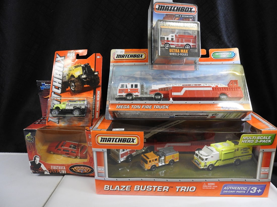 Matchbox Fire Heroes and Monster Garage Vehicles, Lot of 5: Five packaged fire and rescue selections: Matchbox Blaze Buster Trio, Mega Tow fire truck, Supreme Hero Ultra Max, MBX Heroic Rescue vehicle and a Monster Garage Firetruck Limo.