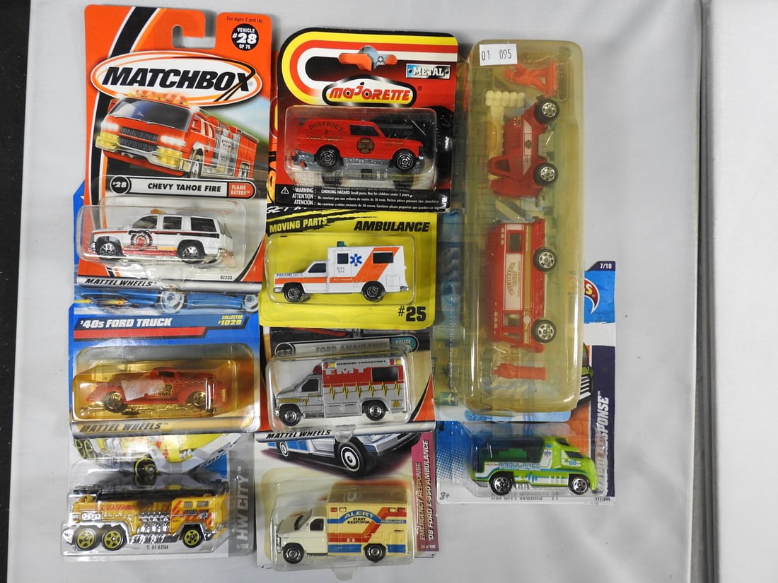 Matchbox, Hot Wheels and Majorette Fire Vehicles: Mixed group of carded Matchbox, Hot Wheels and Majorette fire, rescue and service vehicles, including fire trucks, ambulance, tanker and Chevrolet Tahoe Fire subjects.