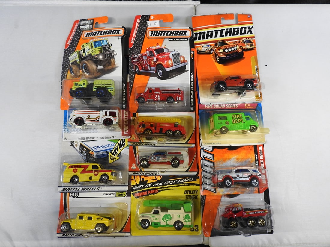 Matchbox and Hot Wheels Fire and Rescue Vehicles: Mixed carded group of Matchbox and Hot Wheels fire, rescue and work vehicles, including Light & Sound, Hero City, MBX Heroic Rescue, Mack truck and Fire Squad subjects.