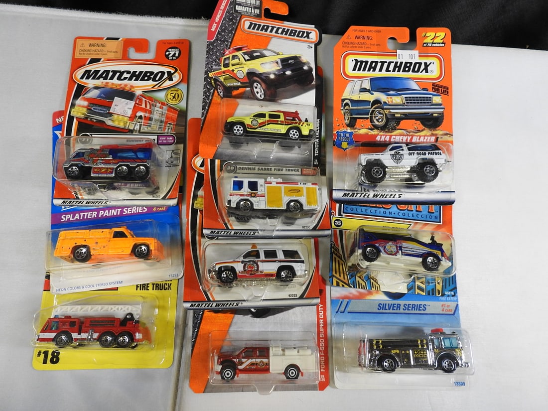 Matchbox and Hot Wheels Fire and Rescue Vehicles: Mixed carded group of Matchbox and Hot Wheels fire and rescue vehicles, including Chevrolet Tahoe Fire, Rescue Ranger, ladder truck, Dennis Sabre, Chevrolet Blazer and Hero City subjects.