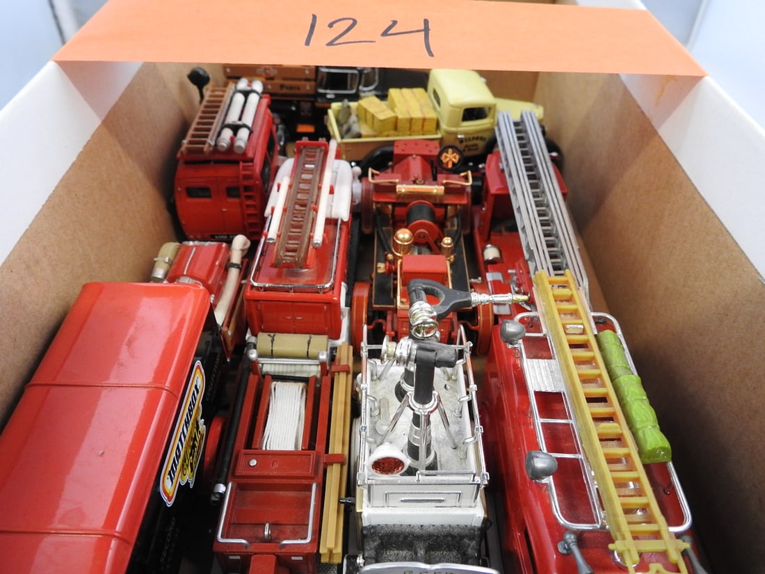 Die-Cast Fire Apparatus Collection: Loose collection of die-cast fire apparatus, including ladder trucks, pumpers and vintage-style fire engines in mixed scales and makers.