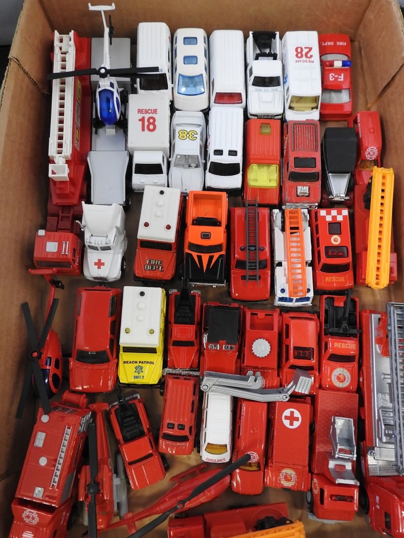 Two Large Fire Trucks with Mini Emergency Vehicle Lot: Mixed fire and emergency vehicle collection comprising two large plastic fire trucks and a large assortment of smaller fire, rescue, ambulance and police vehicles.