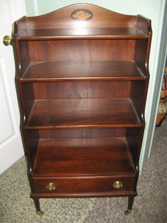 Inlayed Solid Mahogany Whatnot shelf Etegere: sets on 4 turned legs with brass coasters with one drawer, 2 ornate brass pulls, with inlayed shell patern in the rear crest.