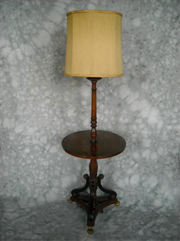 Kittinger Style Shaft Table With Lamp: A nice table with a central lamp. The Base is decorated nicely with Rosettes, rope twist, & Acanthus leaves. Sets nicely on cast brass ball and hairy paw feet. Lamp is a double socket with central lam