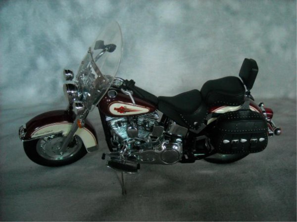 Ertl Type Model of A Harley Davidson Softtail: Heritage Softail Classic, Red and cream in color.