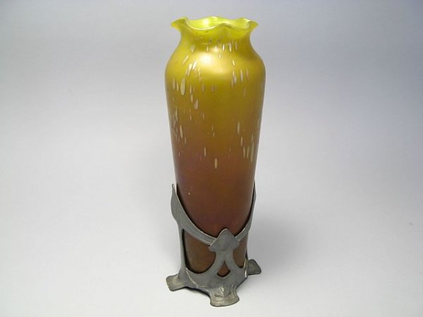 Loetz Phonomen Genre Art Glass Vase: A Phonomen Genre vase in canadia background with mauve and bright yellow, spots in opalescent pink. Designed by Loetz. On stand. Metal armatures. Made in Austria c. 1900,s. H. 12", some wear around ba