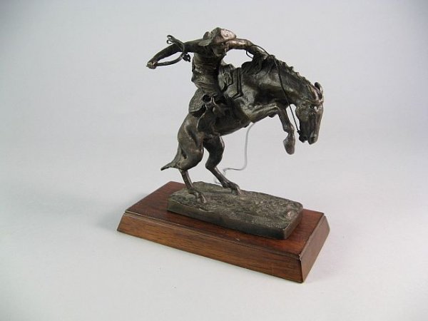 Franklin Mint Bronze Reminington Bronco Buster: Titled "Official Issue Of The Frederic Remington Art Musuem c. 1988 The Franklin Mint" on a wood stand. H.6"