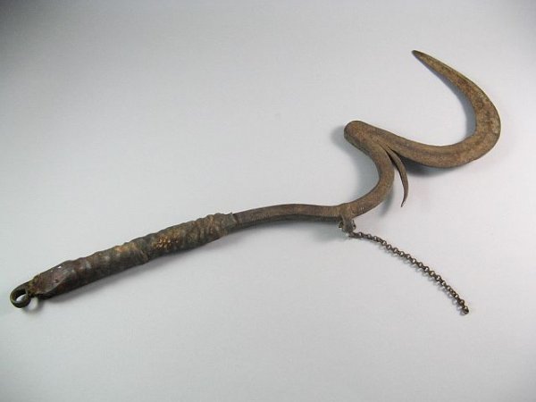 African Mafa Tribal Throwing Knife Currency: Iron with etchings and stitched animal hide covered handle. L. 22" late 19th / early 20th century