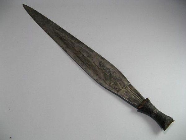 African Tribal Weapon Currency Blade: Has wood handle wrapped in laced copper wire. L.30".