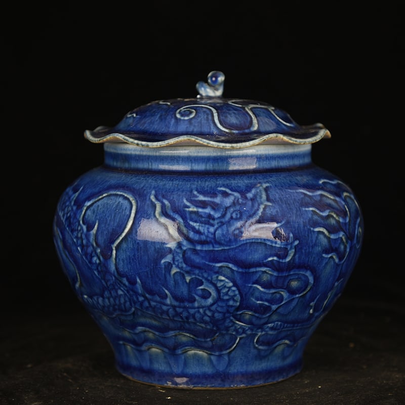An Exquisite Chinese blue glaze carved dragon pattern lotus leaf jar