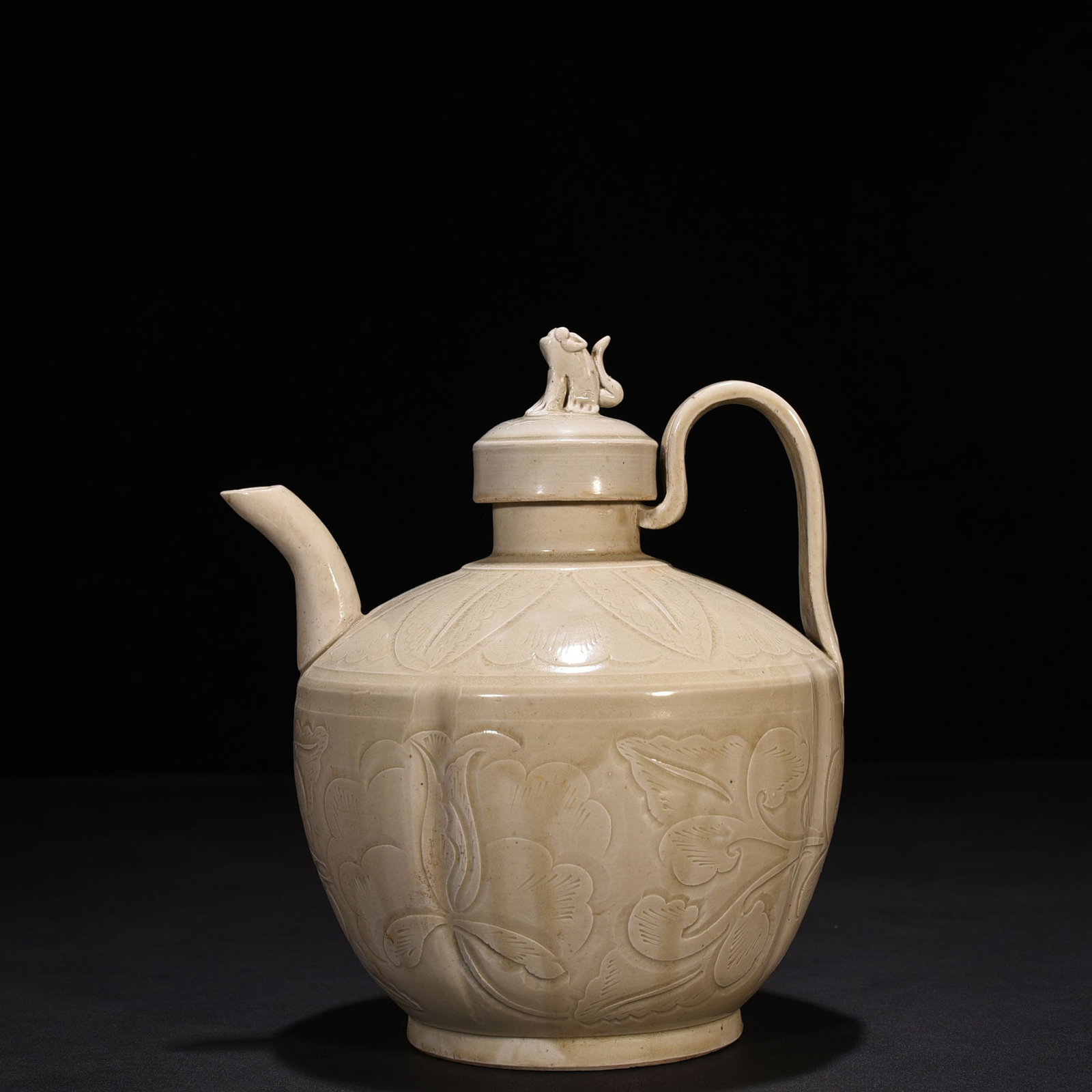 An Exquisite Chinese Ding kiln carved peony pattern