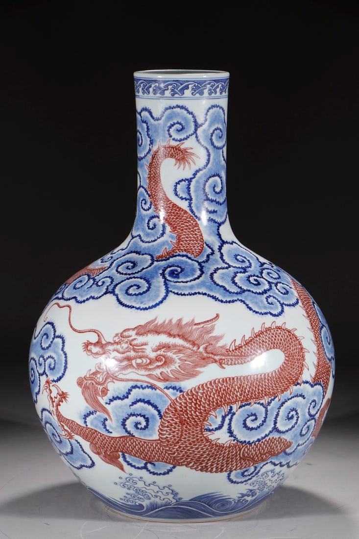An Exquisite Chinese blue and white glaze celestial vase with red sea water and clouds and dragons: Size: Height 53 cm - Width 14.2 cm |Materials: Porcelain |Style Dynasty: Qing dynasty |Inscription: Qianlong Mark |Object: Chinese Antique