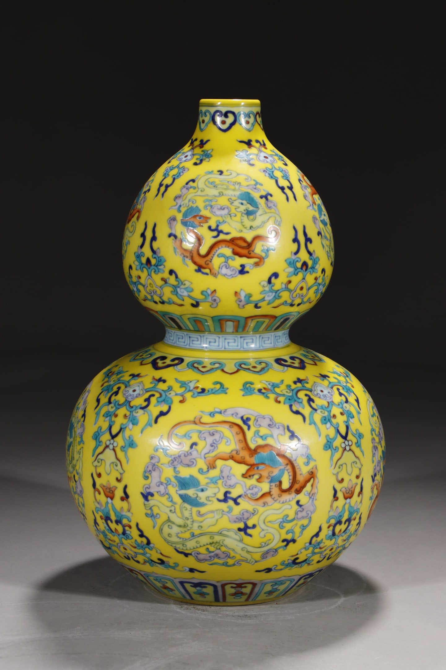An Exquisite Chinese gourd vase with lotuses and dragons on yellow ground: Size: Height 30.5 cm - Width 14.2 cm |Materials: Porcelain |Style Dynasty: Qing dynasty |Inscription: Qianlong Mark |Object: Chinese Antique