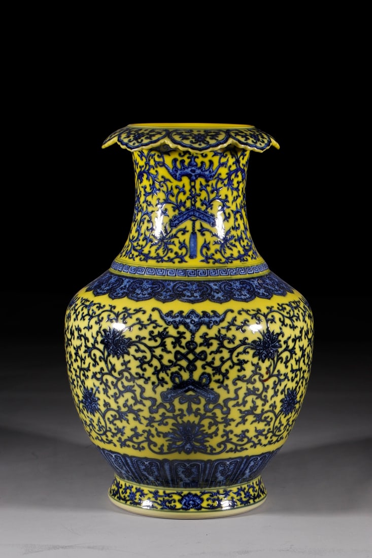 An Exquisite Chinese vase with yellow ground blue and white flowers and lotus mouth: Size: Height 39.5 cm - Width 14.2 cm |Materials: Porcelain |Style Dynasty: Qing dynasty |Inscription: Qianlong Mark |Object: Chinese Antique
