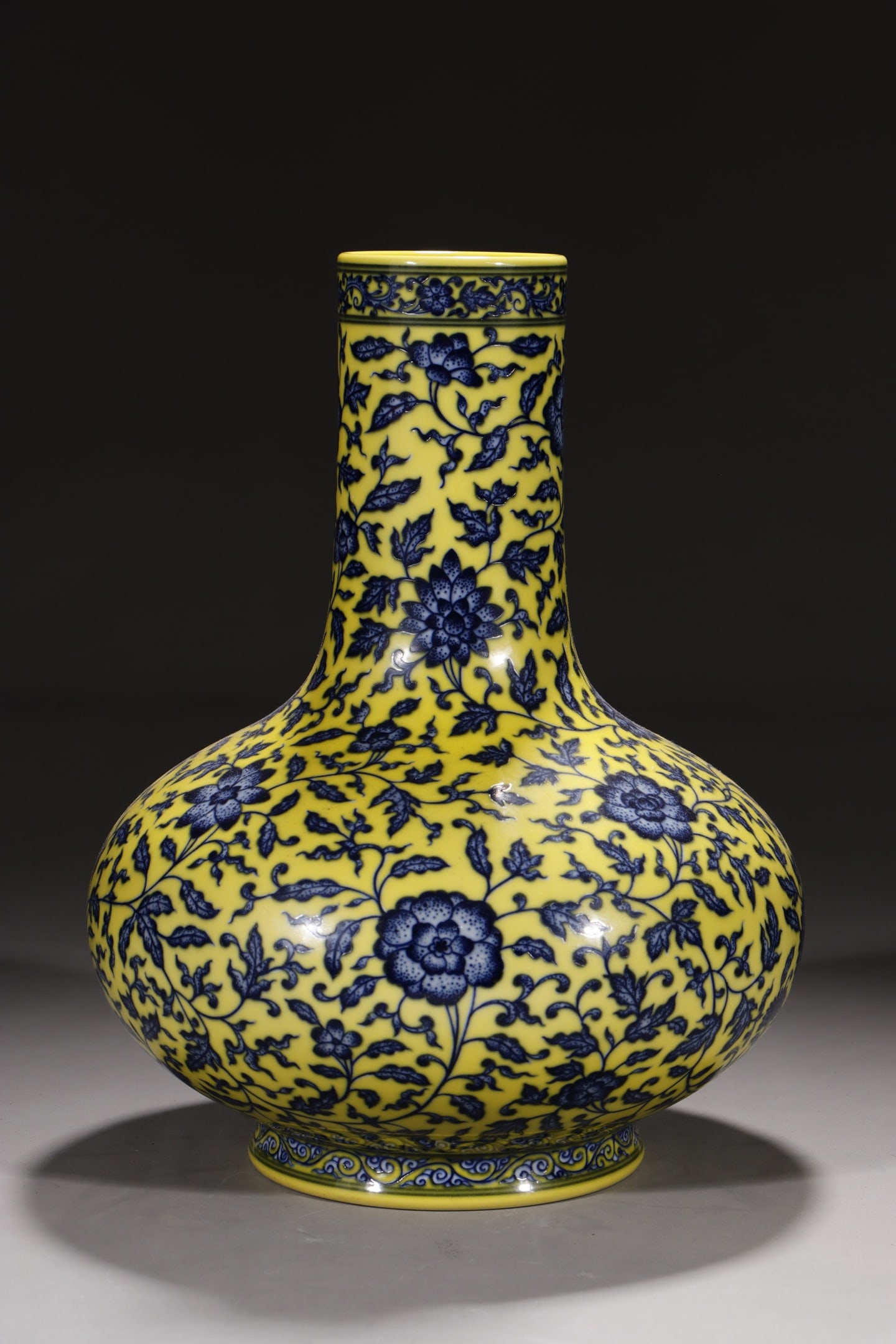 An Exquisite Chinese flat bellied vase with yellow ground and blue and white flowers intertwining: Size: Height 33 cm - Width 14.2 cm |Materials: Porcelain |Style Dynasty: Qing dynasty |Inscription: Qianlong Mark |Object: Chinese Antique