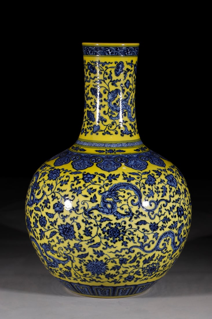 An Exquisite Chinese Yellow ground blue and white celestial sphere vase with lotus and dragon (1 of 9)