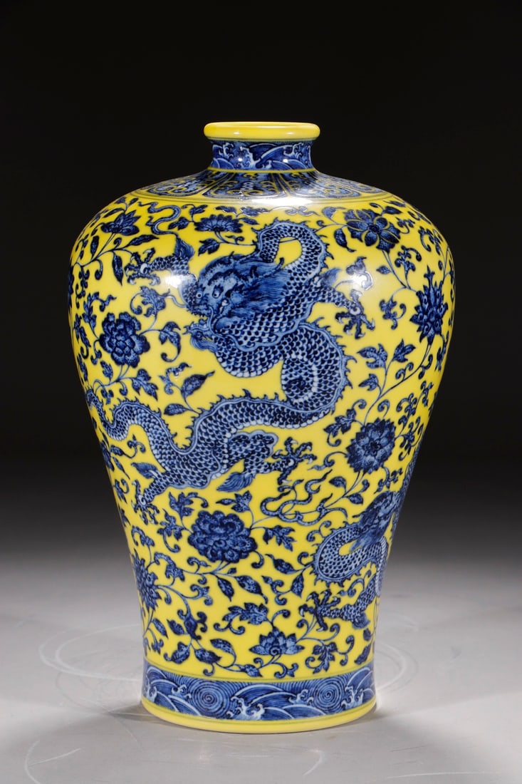 An Exquisite Chinese plum vase with blue and white flowers on yellow ground and entwining branches: Size: Height 35 cm - Width 14.2 cm |Materials: Porcelain |Style Dynasty: Qing dynasty |Inscription: Qianlong Mark |Object: Chinese Antique