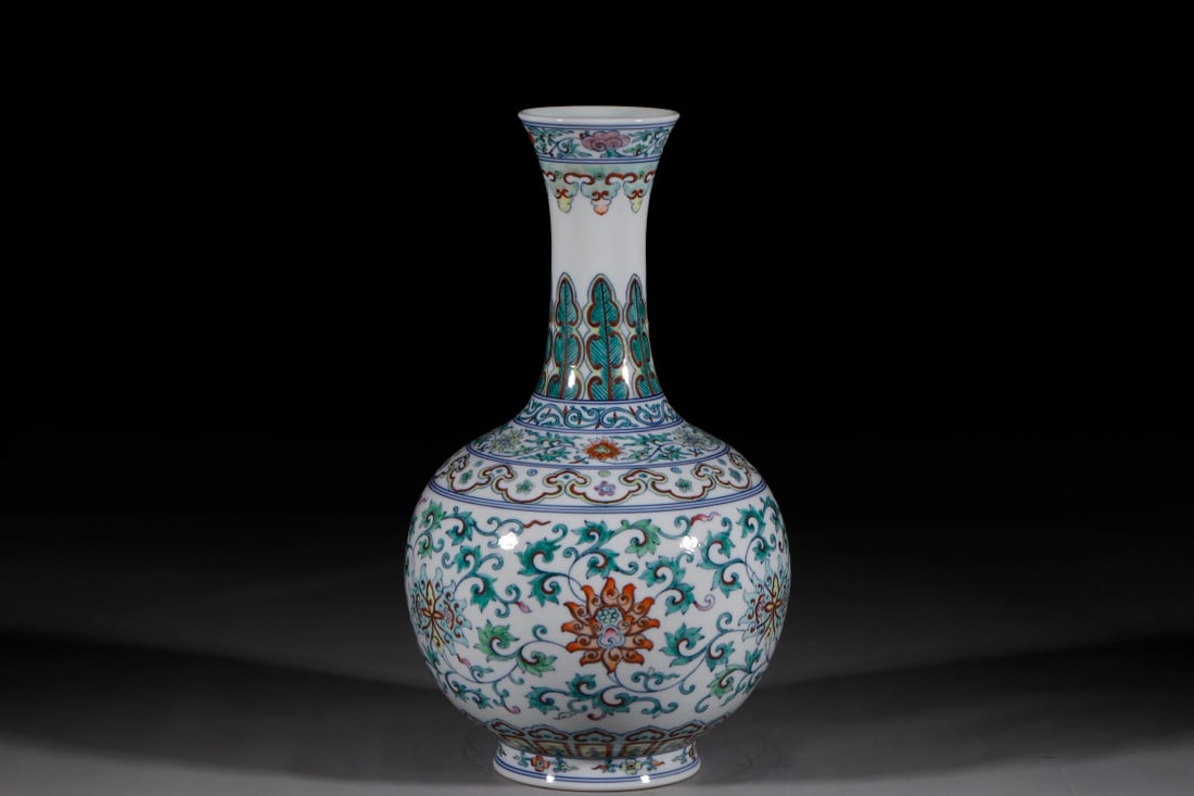 An Exquisite Chinese blue and white vase with colorful entwined branches and flowers: Size: Height 38 cm - Width 14.2 cm |Materials: Porcelain |Style Dynasty: Qing dynasty |Inscription: Qianlong Mark |Object: Chinese Antique