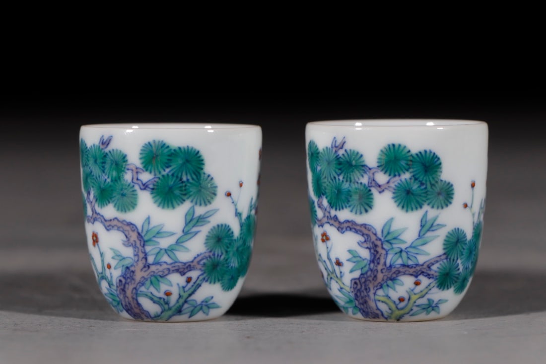 An Exquisite Chinese Yin Pavilion Doucai cup with pine bamboo and plums: Size: Height 3.9 cm - Width 3.7 cm |Materials: Porcelain |Style Dynasty: Qing dynasty |Inscription: Qianlong Mark |Object: Chinese Antique