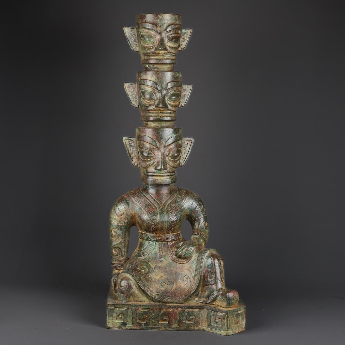 An Exquisite Chinese Bronze three-sided lifting figure: Size: Height 66 cm - Width 29 cm |Materials: Bronze |Style Dynasty: Sanxingdui dynasty |Attributed: 1700-bc |Object: Chinese Antique