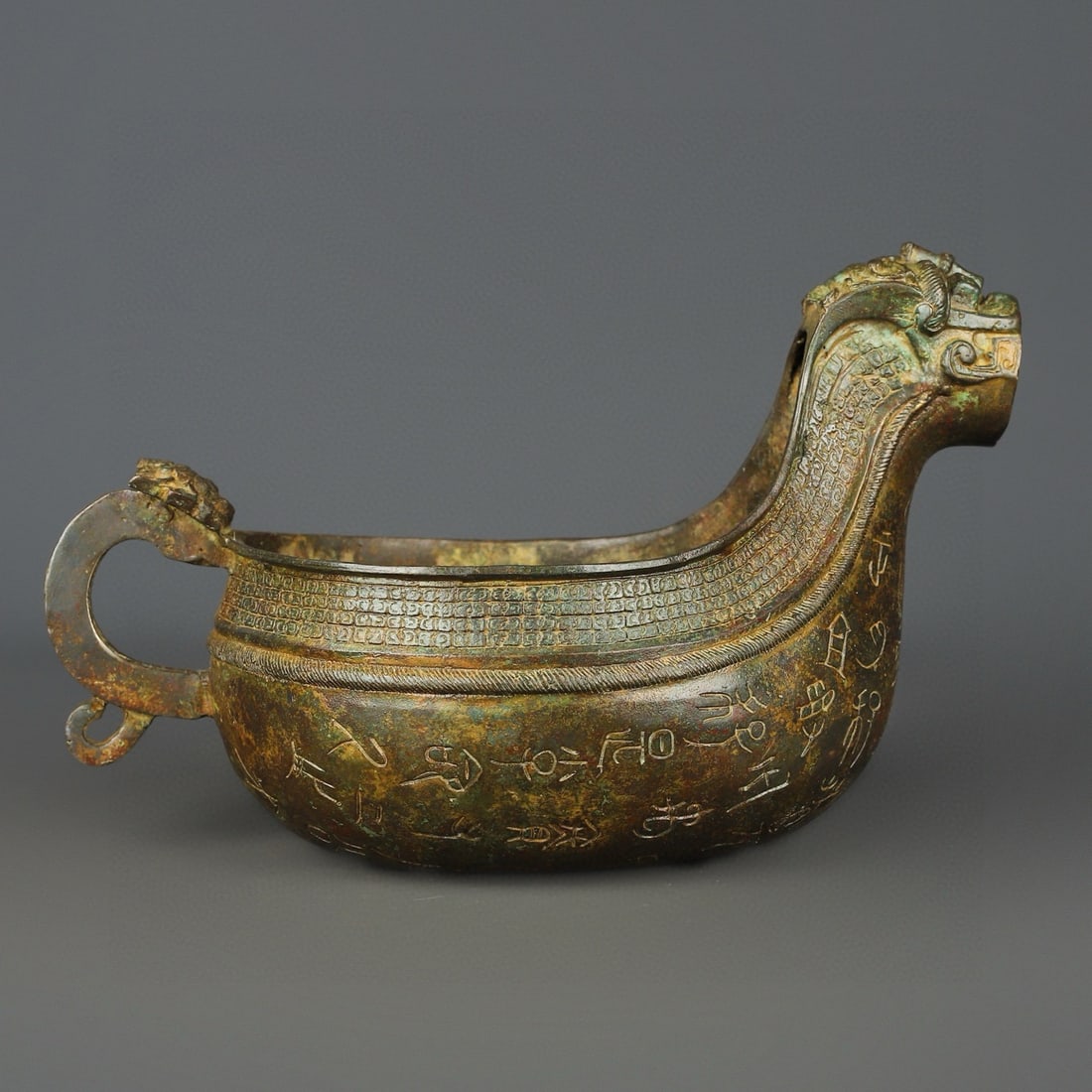 An Exquisite Chinese Bronze animal head inscription: Size: Height 18 cm - Width 29 cm |Materials: Bronze |Style Dynasty: zhou dynasty |Attribution: 700-BC |Object: Bell