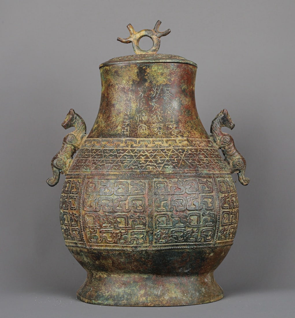 An Exquisite Chinese Bronze Double Dragon Flat Jar: Size: Height 32 cm - Width 24 cm |Materials: Bronze |Style Dynasty: zhou dynasty |Attribution: 700-BC |Object: Bell