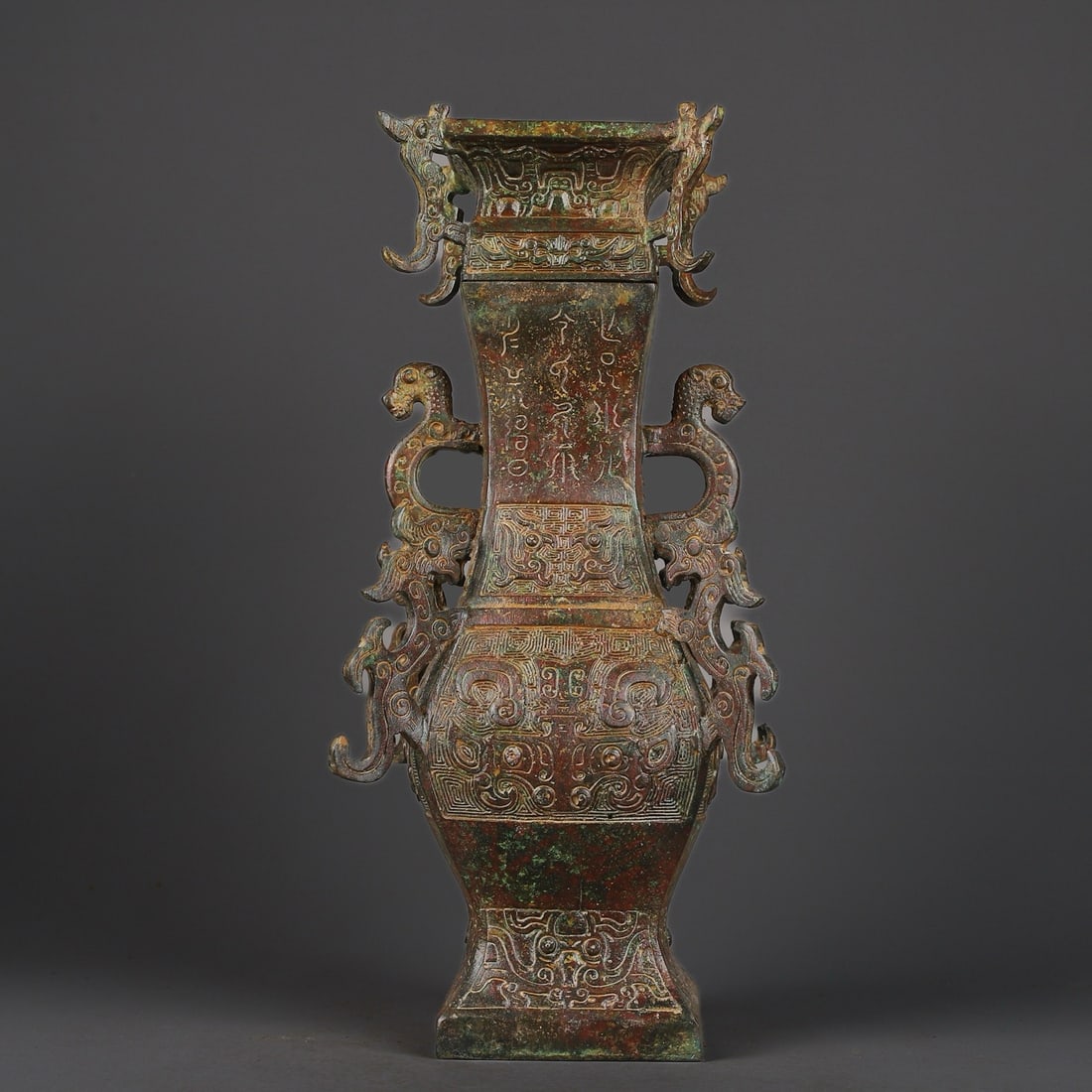 An Exquisite Chinese Bronze Square Vase with Four Dragons Inscription: Size: Height 33 cm - Width 16 cm |Materials: Bronze |Style Dynasty: zhou dynasty |Attribution: 700-BC |Object: Bell