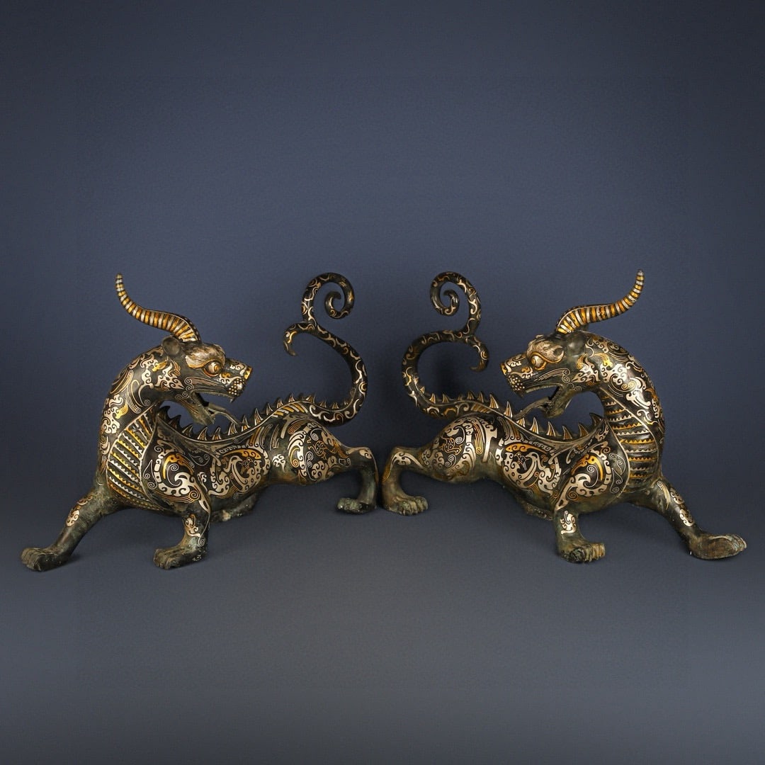 An Exquisite Chinese Pair of Bronze and Gold and Silver One horned and Long tailed Beasts: Size: Height 39 cm - Width 60 cm |Materials: Bronze |Style Dynasty: Han dynasty |Attribution: 1st to 3rd-C |Object: Bell