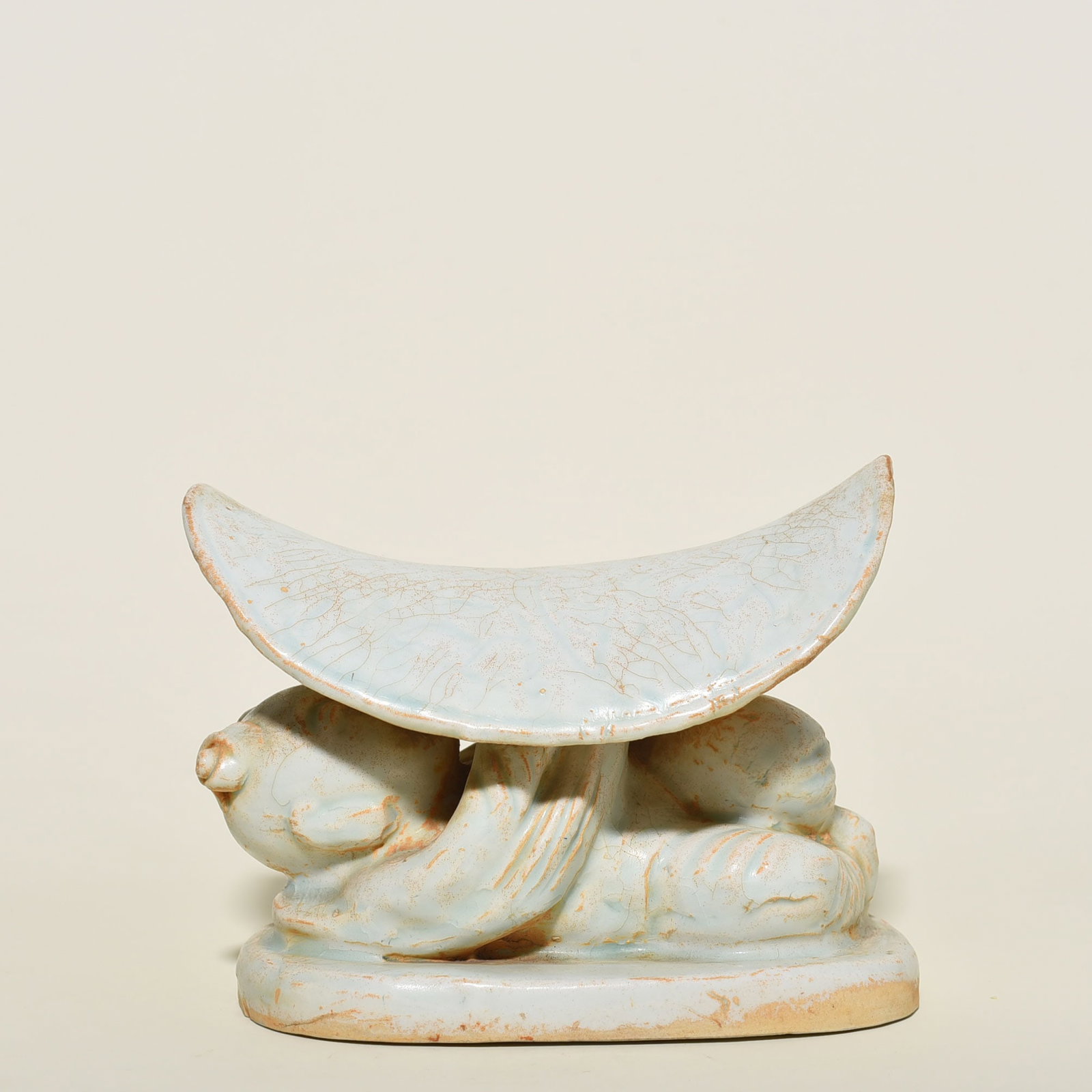 An Exquisite Chinese Hutian kiln shadow celadon child pillow doll pillow: Size: Width 18 cm - Height 13 cm |Materials: Porcelain |Style Dynasty: Song Dynasty |Attribution: 10th-c |Object: pillow