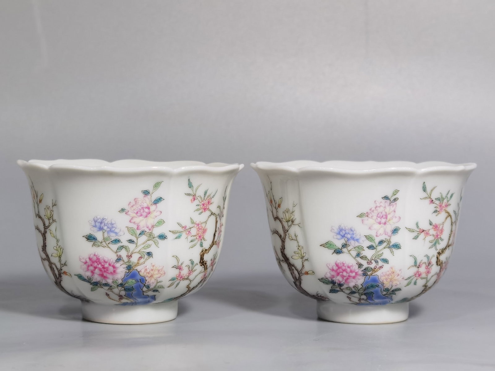 An Exquisite Chinese A pair of pastel flower Kuikou cups from the: Size: Width 7.2 cm - Height 4.9 cm |Materials: Porcelain |Style Dynasty: Qing dynasty |Inscription: Qianlong Mark |Object: cup