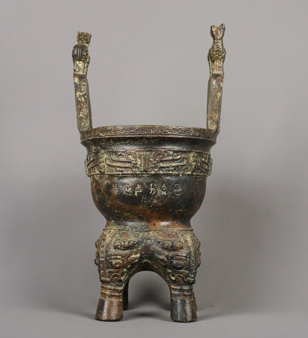 An Exquisite Chinese Bronze animal faced mortar: Size: Height 28 cm - Width 15 cm |Materials: Bronze |Style Dynasty: zhou dynasty |Attribution: 700-BC |Object: Bell