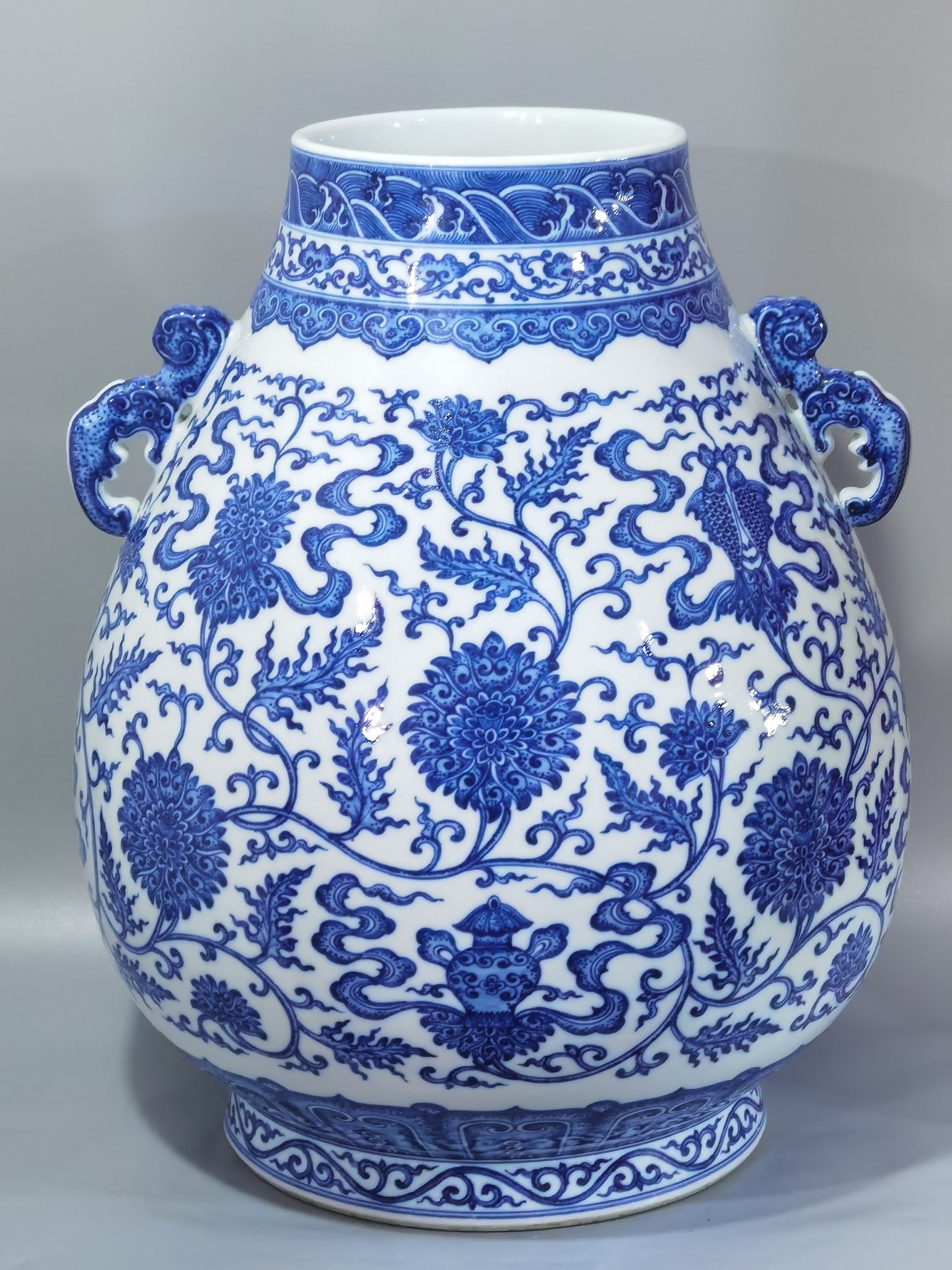 An Exquisite Chinese blue and white entwined branches with eight treasures and lotus: Size: Height 47.5 cm - Width 39 cm |Materials: Porcelain |Style Dynasty: Qing dynasty |Inscription: Qianlong Mark |Object: amphora