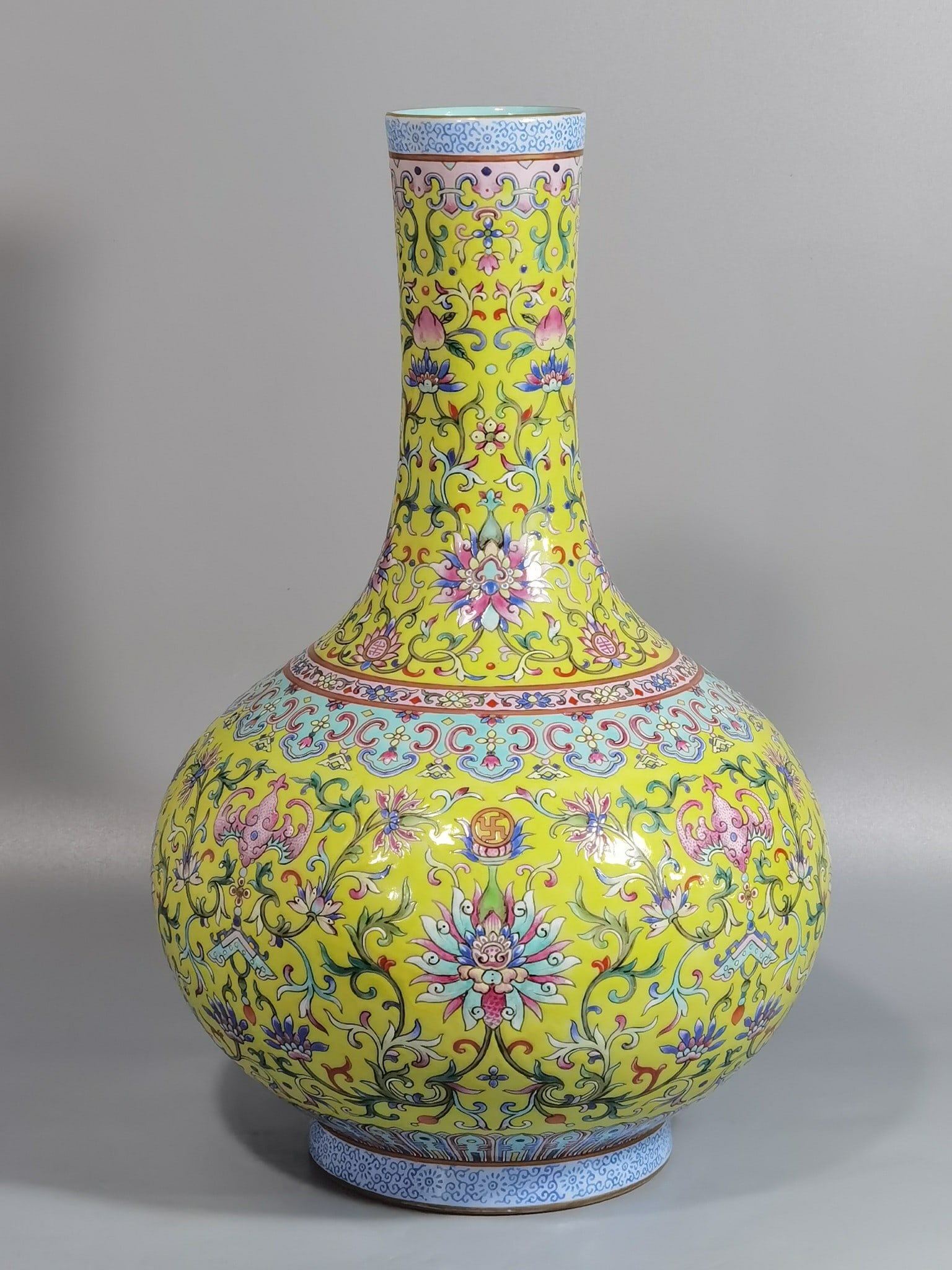 An Exquisite Chinese yellow ground pastel celestial sphere vase: Size: Height 33 cm - Width 21.5 cm |Materials: Porcelain |Style Dynasty: Qing dynasty |Inscription: Qianlong Mark |Object: vase