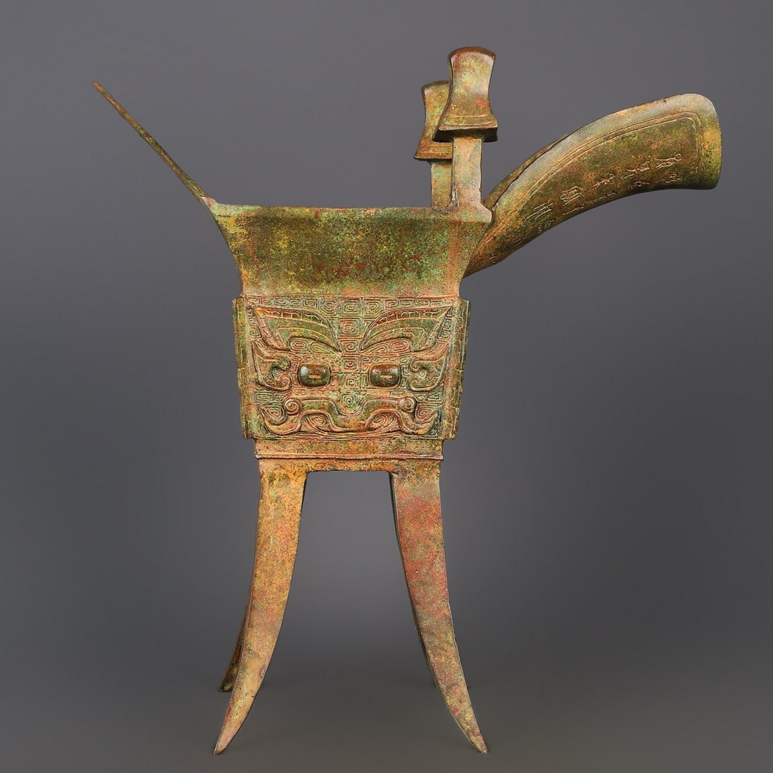 An Exquisite Chinese Bronze Beast Face Fangjue Cup: Size: Height 46 cm - Width 43 cm |Materials: Bronze |Style Dynasty: zhou dynasty |Attribution: 700-BC |Object: Bell