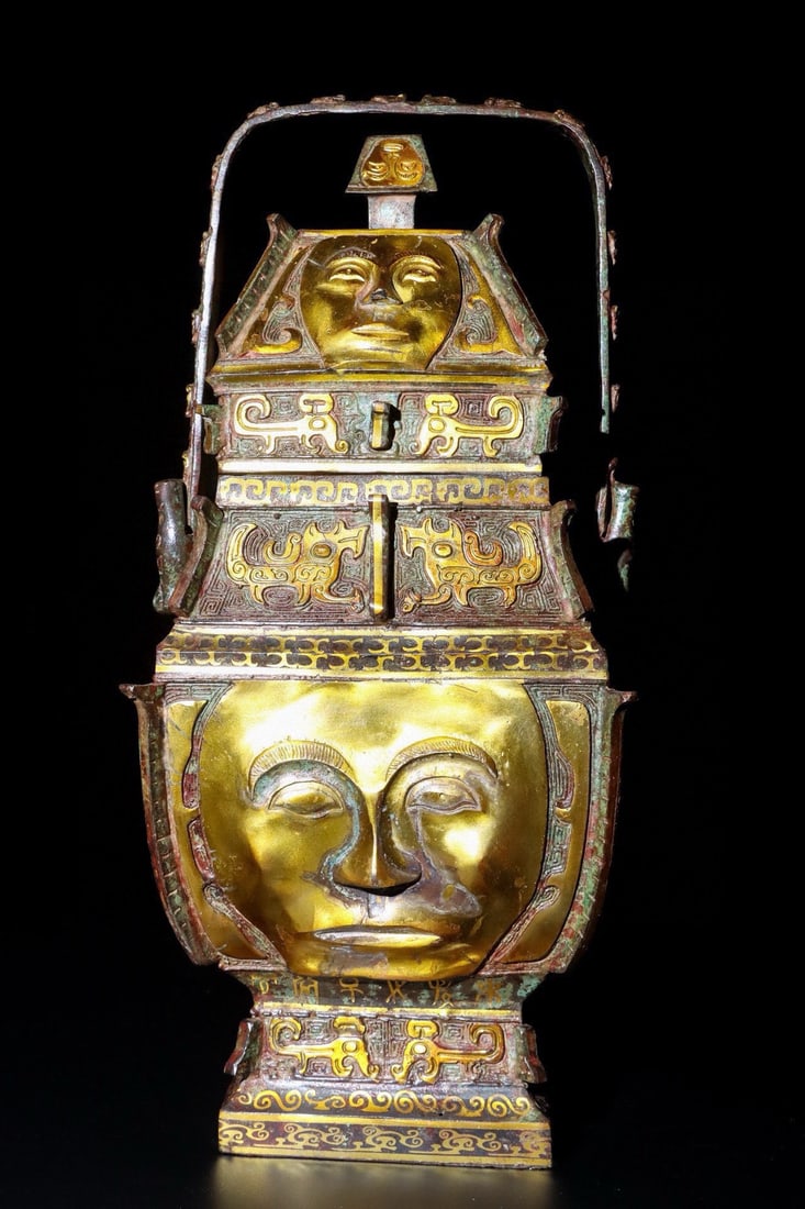 An Exquisite Chinese Bronze and golden human face lifting beam: Size: Height 41 cm - Width 29 cm |Materials: Bronze |Style Dynasty: Han dynasty |Attribution: 1st to 3rd-C |Object: Bell