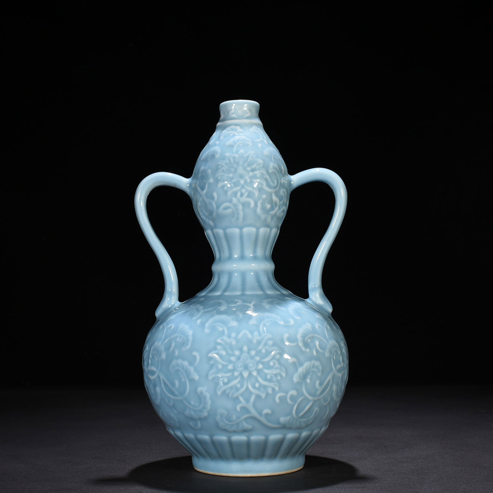 An Exquisite Chinese sky blue glaze carved ruyi ear gourd vase with entwining floral pattern: Size: Height 32 cm - Width 18 cm |Materials: Porcelain |Style Dynasty: Qing dynasty |Inscription: Qianlong Mark |Object: vase