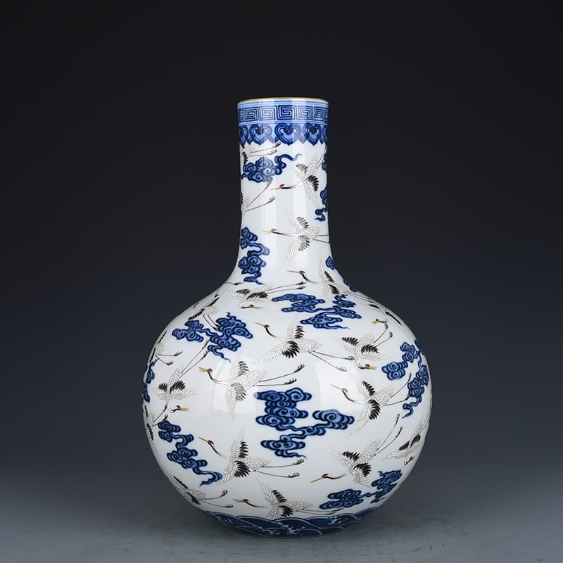 An Exquisite Chinese blue and white pastel cloud and crane pattern celestial sphere vase: Size: Height 34 cm - Width 21 cm |Materials: Porcelain |Dynasty: Qing dynasty |Inscription: Qianlong Mark |Object: vase