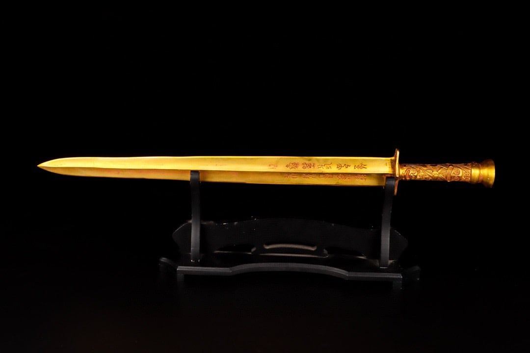 An Exquisite Chinese Bronze gilt sword with animal handle and inscription: Size: Height 65.5 cm - Width 7 cm |Materials: Bronze |Dynasty: Han dynasty |Attribution: 1st to 3rd-C |Object: Bell