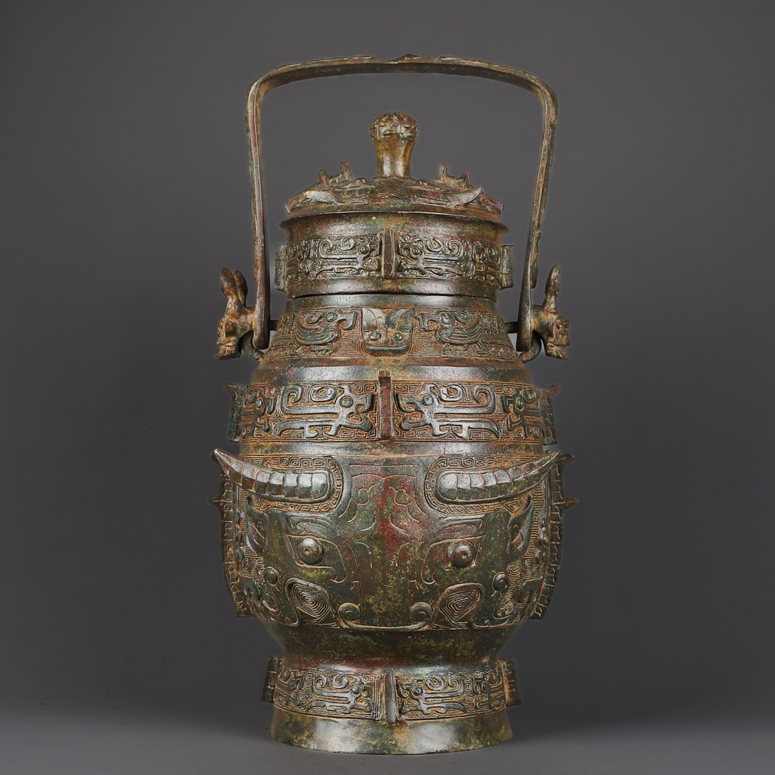 An Exquisite Chinese Bronze full gong animal faced round handle: Size: Height 48 cm - Width 25 cm |Materials: Bronze |Dynasty: zhou dynasty |Attribution: 700-BC |Object: Bell