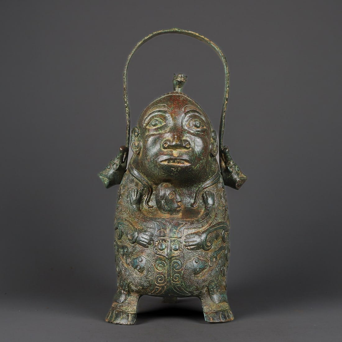 An Exquisite Chinese Bronze Human Face Handle Lifting Handle: Size: Height 36 cm - Width 20 cm |Materials: Bronze |Dynasty: zhou dynasty |Attribution: 700-BC |Object: Bell
